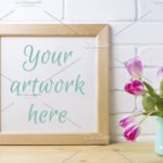 Wooden square frame mockup with flower