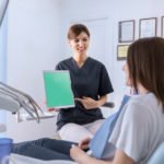 Free Dentist holding Tablet mockup