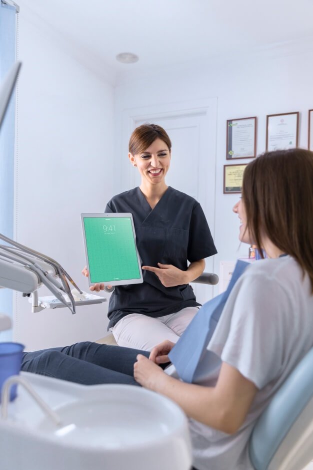 Free Dentist holding Tablet mockup