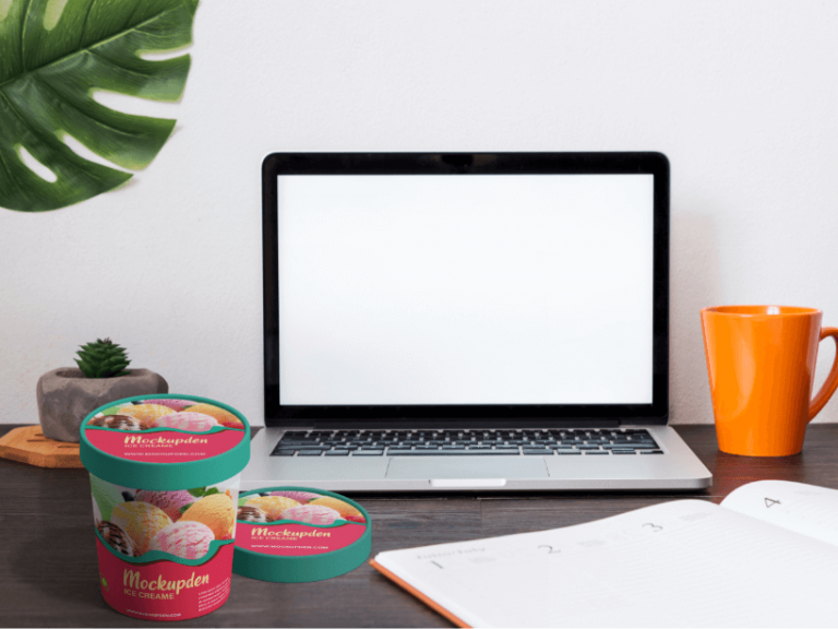 Free Ice Cream Cup On Work Table Mockup | PSD Template