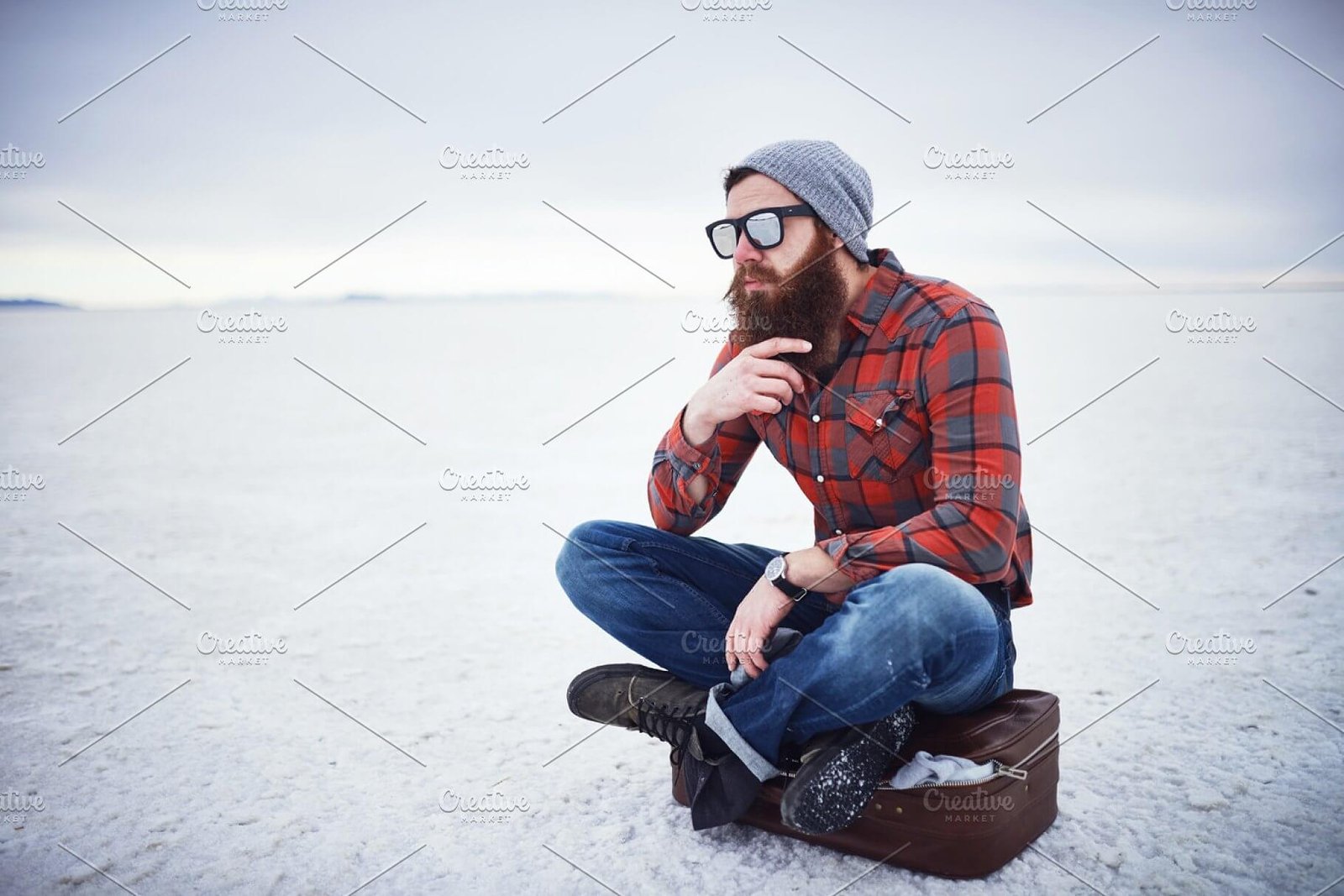 A Beard Man Sitting On A Cold Place Wearing Beanie Mockup