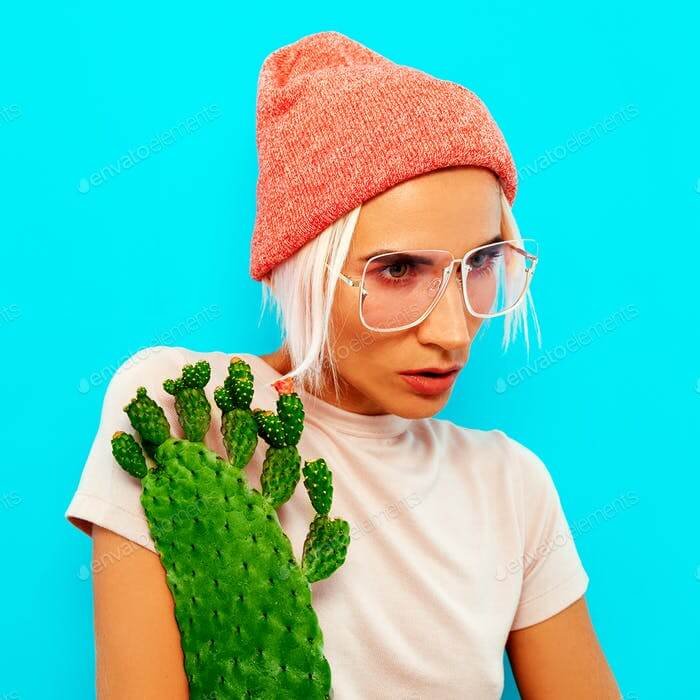 A Stylish Hipster Blonde Model Wearing Pink Colored Beanie PSD Mockup