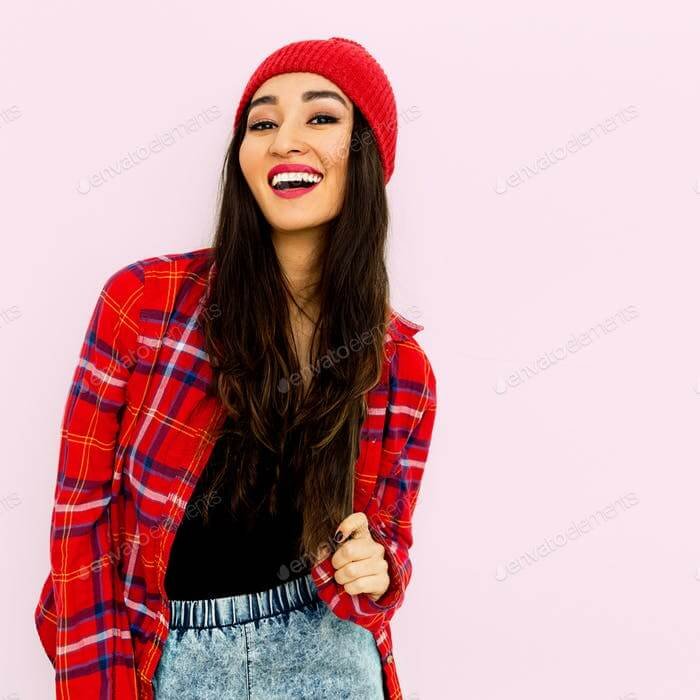 Happy Brunette Girl Wearing A Red Beanie PSD Mockup