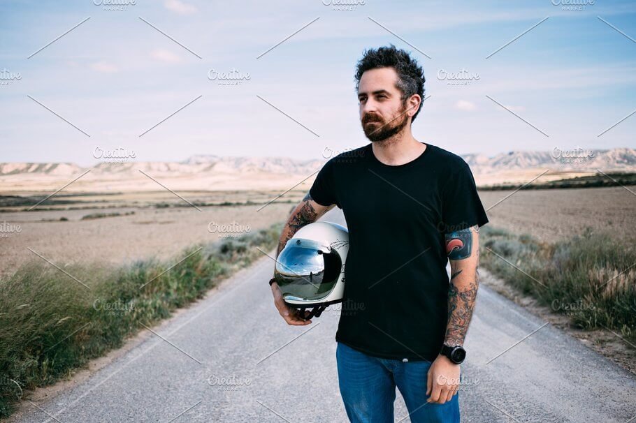 Tattooed Guy with Helmet on Hand Mockup PSD