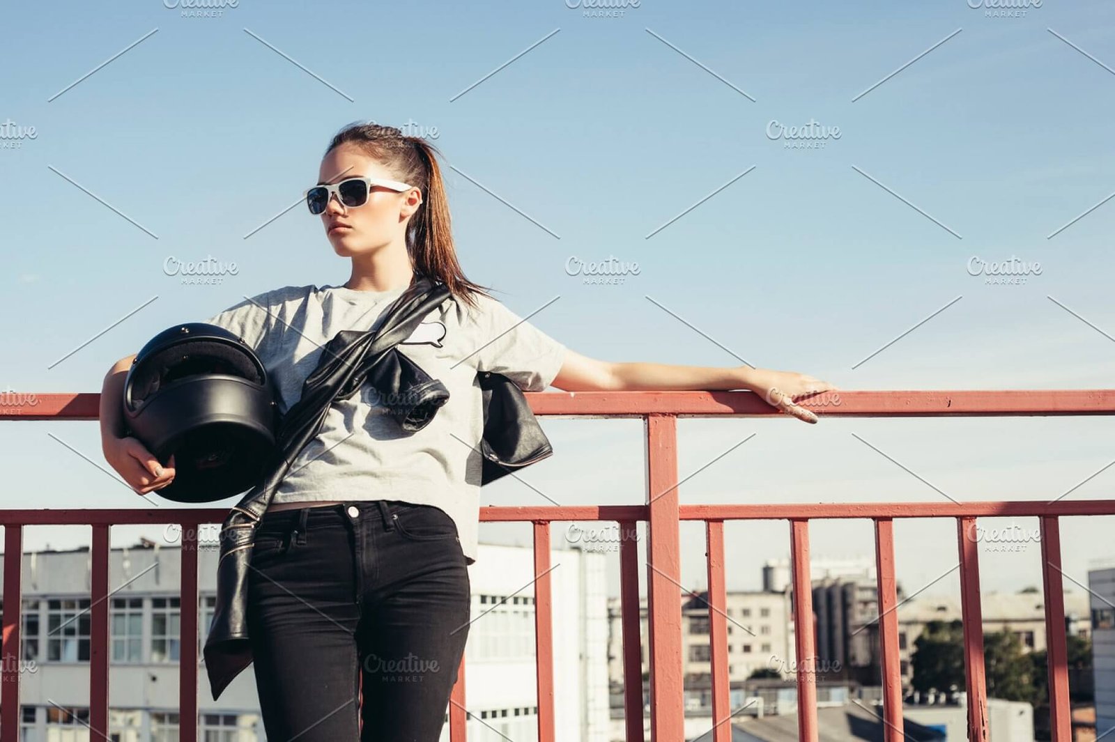 Young Female Holding Her Motorcycle Helmet In Her Arm Mockup