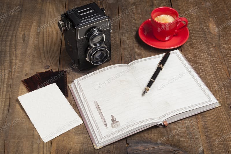 A Camera Placed With A Blank Copy And Pen Mockup. 
