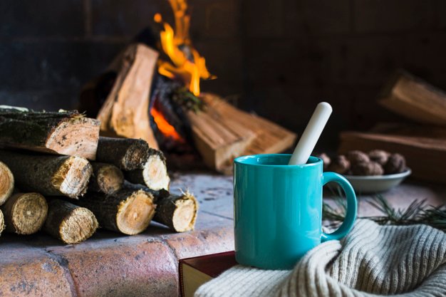 A Mug Is Placed With A Blanket Near Fireplace Template.