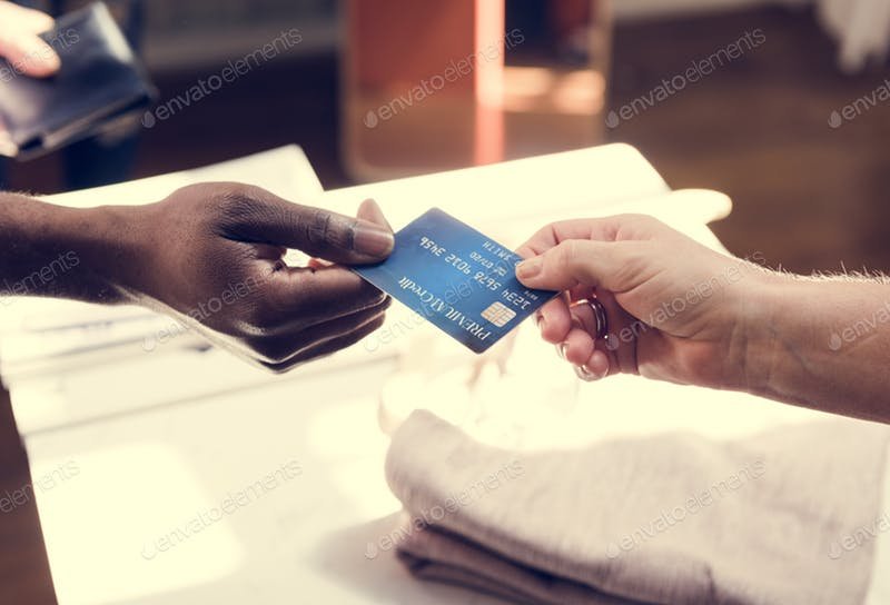A man is giving a Credit card to another person mockup.