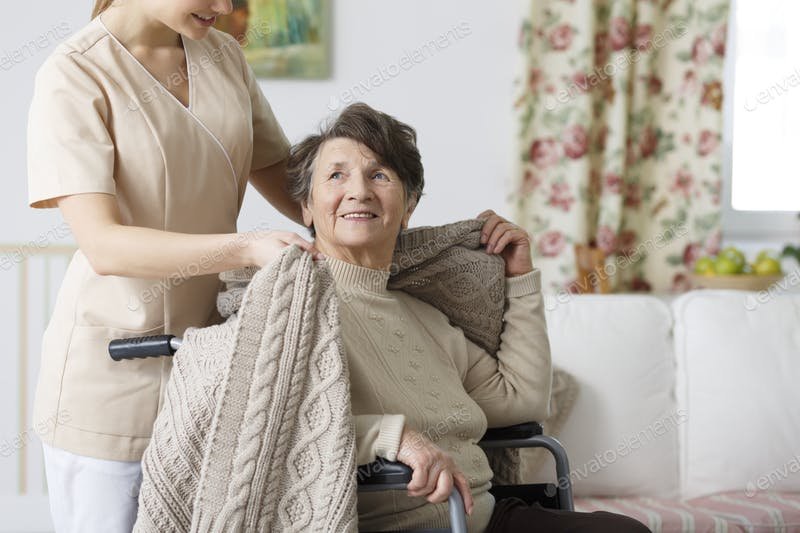 Caretaker Covering A Old lady With A Blanket PSD.