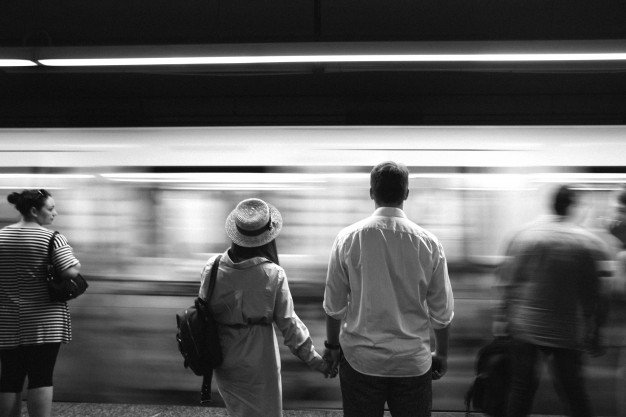 Couple Holding Hand And Standing Infront Of Train