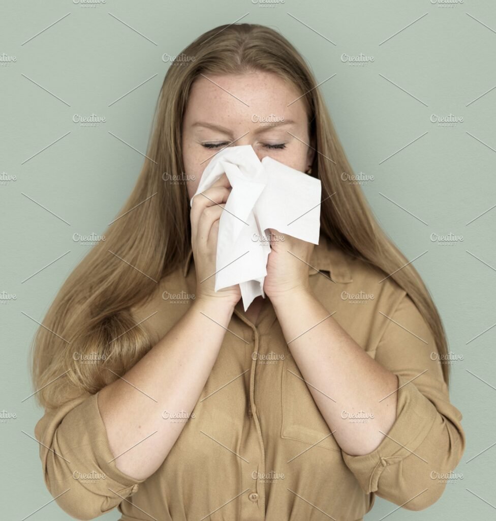Girl Blowing Here Nose With White Tissue