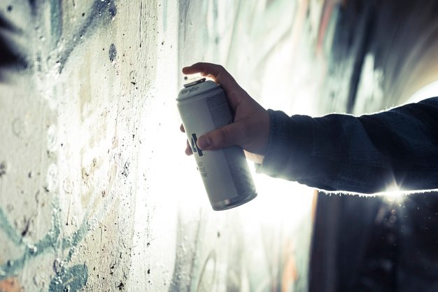 Guy in mood of preparing a masterpiece with spray can Picture