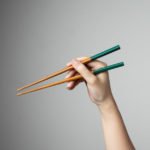 Hand chopstick asian japanese chinese food style traditional Premium Photo