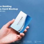 Free Man Holding Business Card Mockup PSD Template