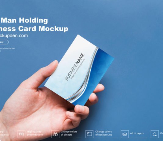 Free Man Holding Business Card Mockup PSD Template