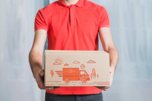 Man Holding Shipping Box Mockup
