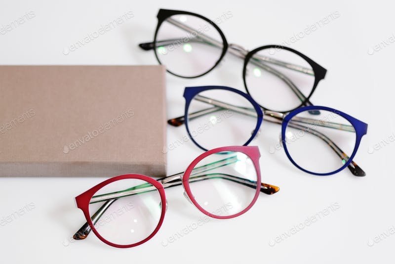 Multicolored fashionable glasses with box Mockup PSD