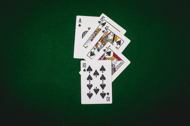 Playing Card On Sap Green Background Premium Photo