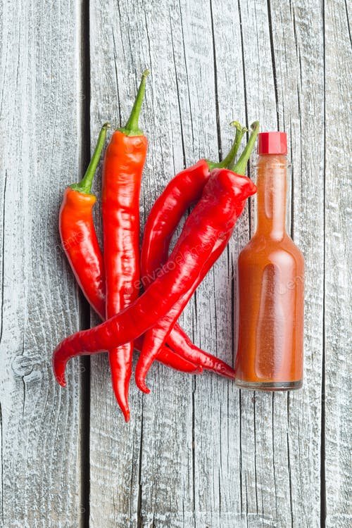 Red Chili With A Sauce Bottle PSD Template