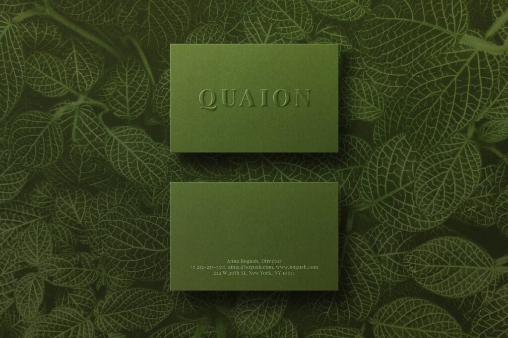 Sap Green Color Business Card Mockup With Leaves Printed In The Background