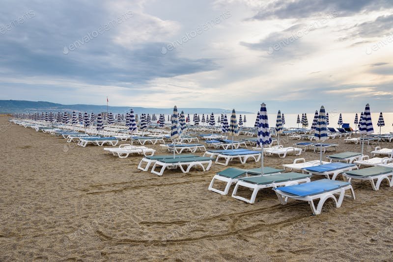 Thousand's Of Blue And White Umbrella In Calabrian Beach PSD Template.