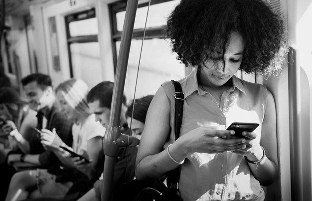 Women Stading Beside The Metro Door And Using Phone