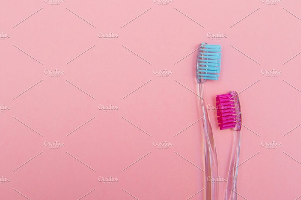 pink and blue toothbrushes