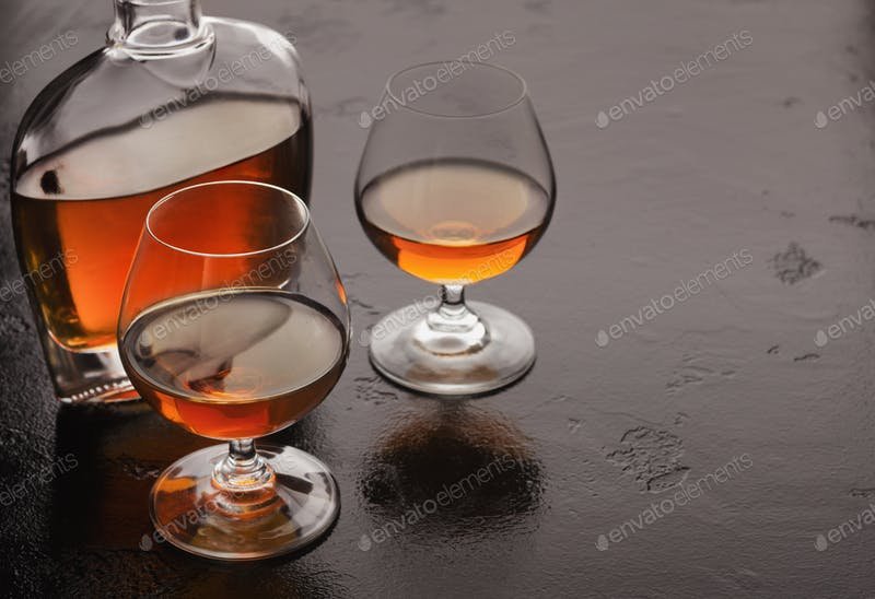 A Bottle And Two Glass Of Brandy PSD Mockup