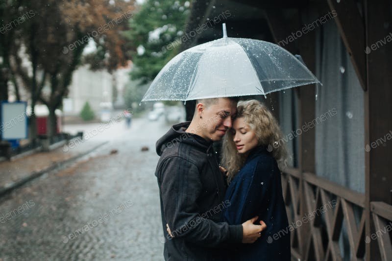 A Couple On The Street With Umbrella PSD File