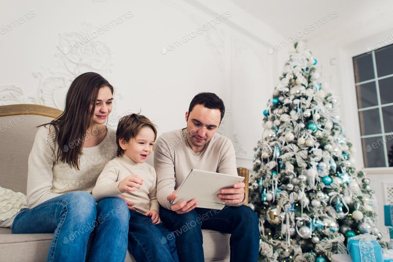 A Family Playing Games On The Tablet PC Mockup.