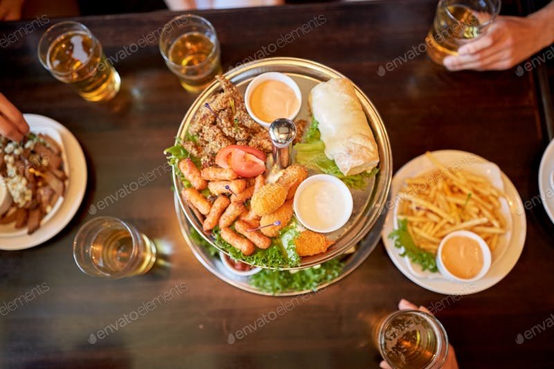 A Food Placed On Table With Many Beer Glass Beside Mockup