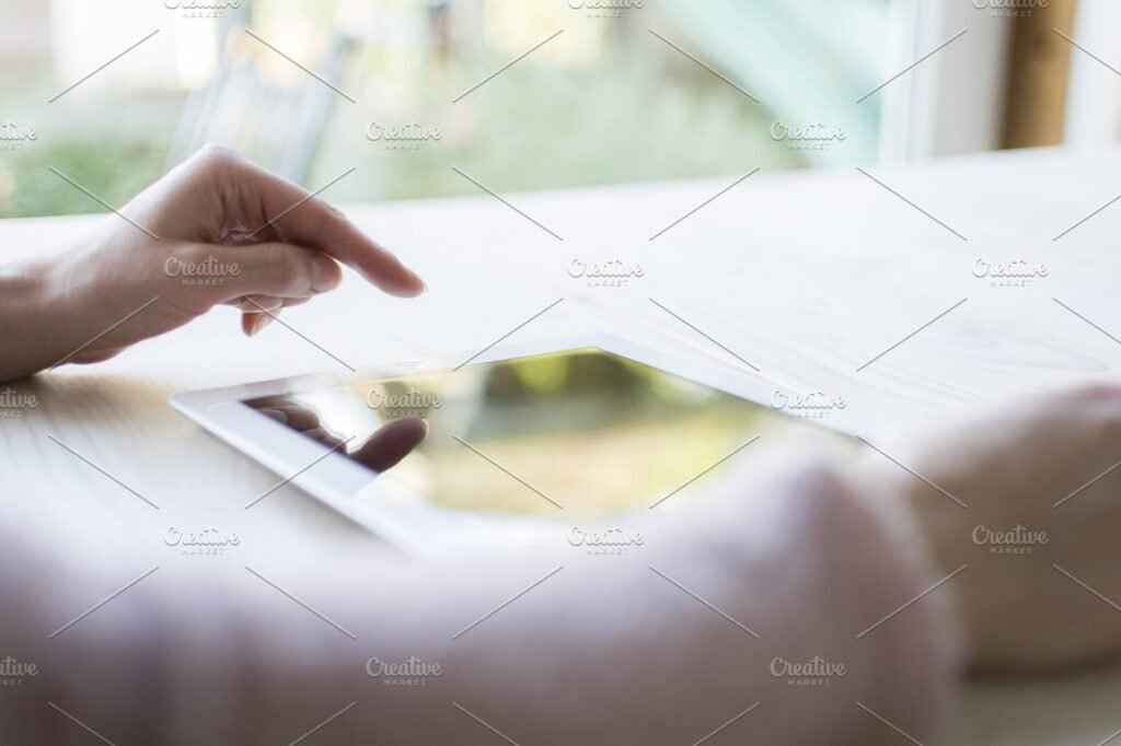 A Hand Using PC Tablet Mockup.