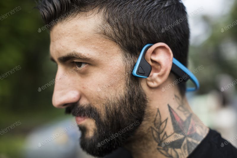 A Man With A Bluetooth Headphone PSD Template.