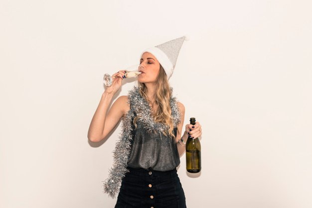 A Women In Santa Hat Drinking Champagne In Glass Mockup