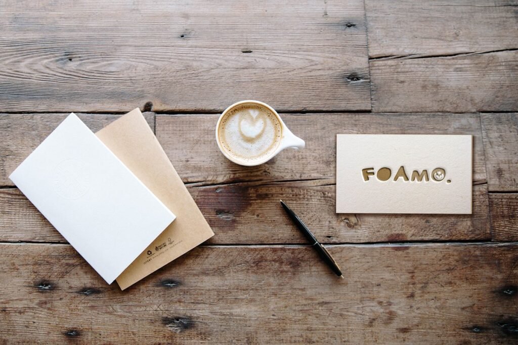 Attractive Image Of A Letterpress Business Card with Coffee Cup And Card Cover Beside
