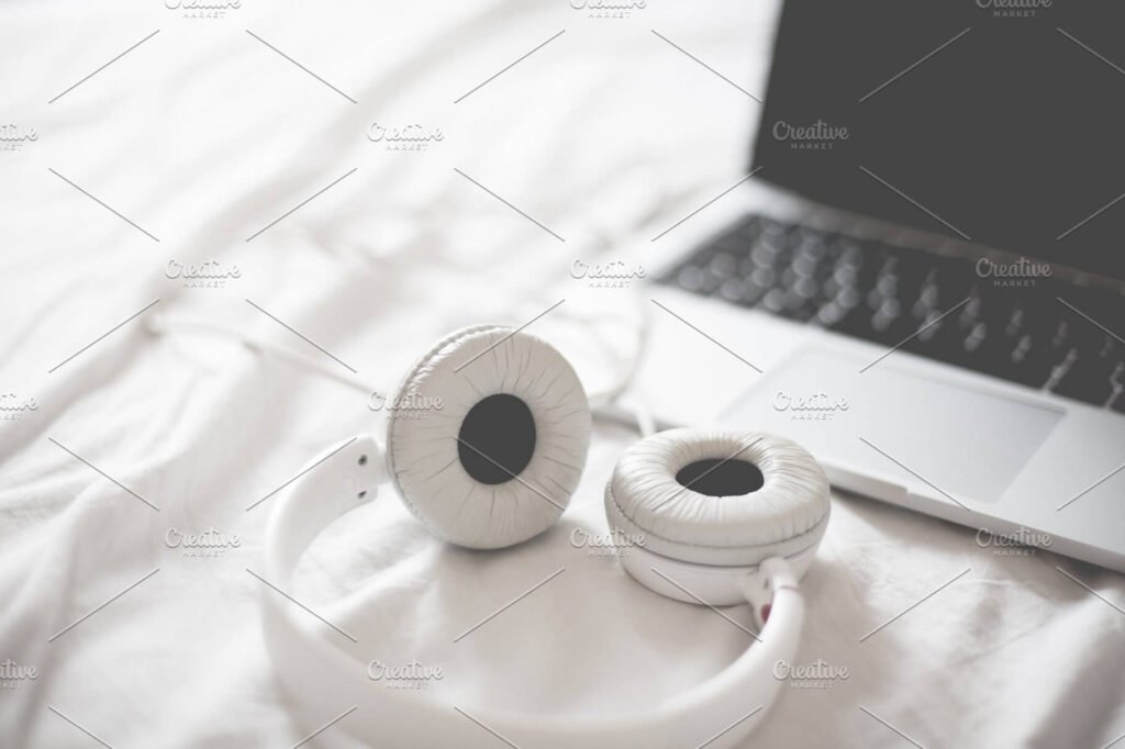 Black And White Headphone With Laptop PSD Mockup.