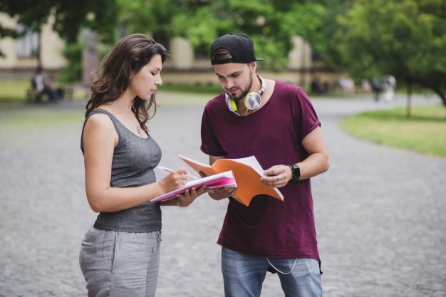 Boy Wearing Snapback Cap And Having A Discussion With Girl