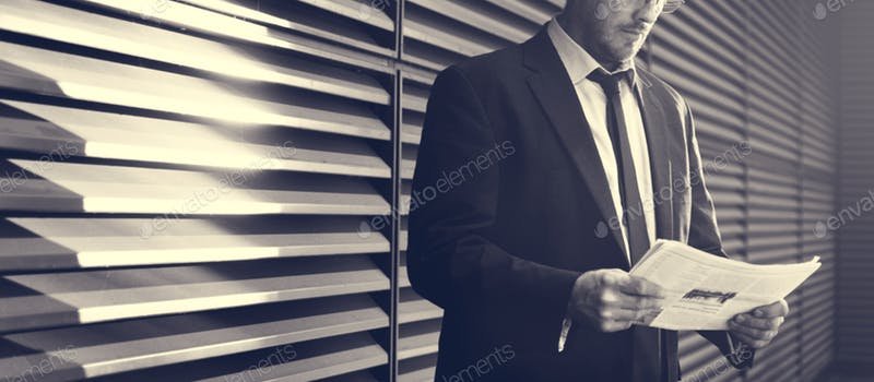 Businessman Reading Newsletter PSD Design