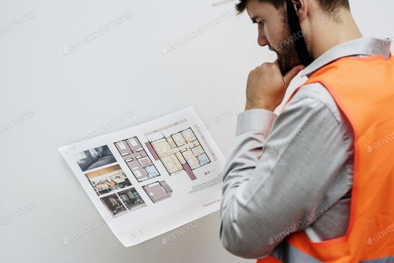 Constructor In A Safety Vest Looking at The Project Template.