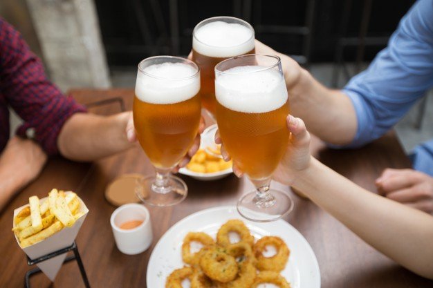 Crop Photo Of Three Friends Clinking Beer Glass Free Photo
