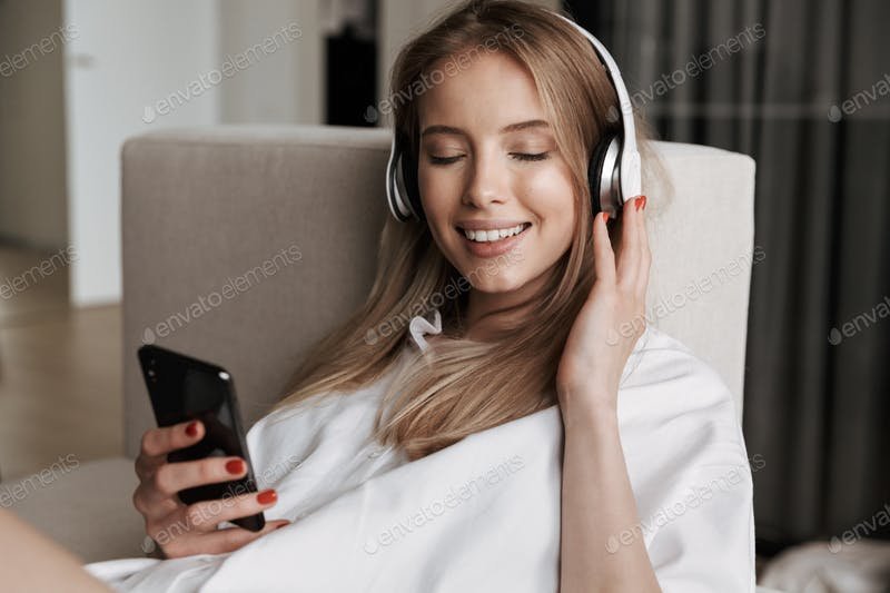 Delighted Woman With Her Headphones PSD Template.