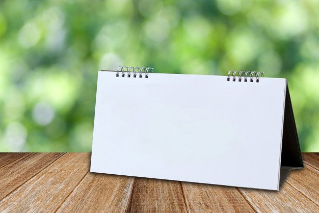 Desk calendar Mockup On Wooden Table