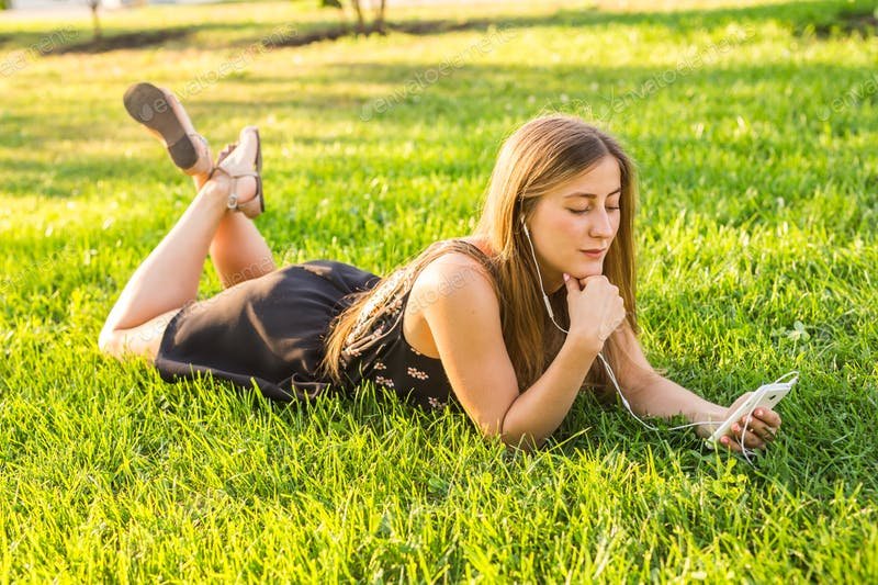 Girl Listening Music In Summer On A Meadow Mockup. 