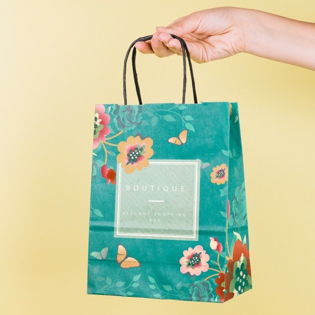 Hand Holding Floral Print Paper Shopping Bag Design Template