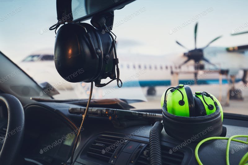 Headphones In A Vehicle Mockup