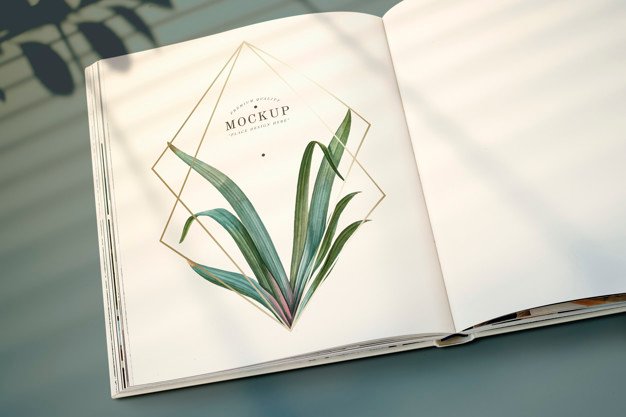 Magazine mockup with leaves and golden frame Free Psd