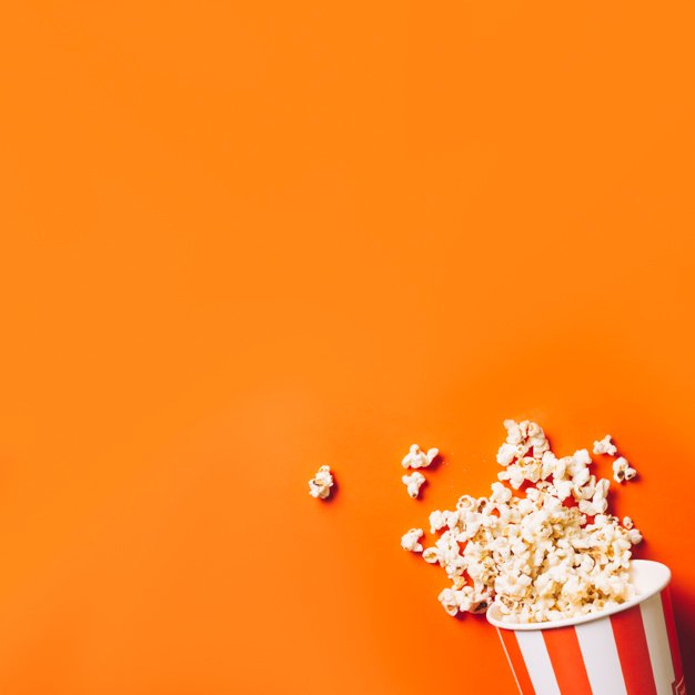 Popcorn bucket over an orange background Picture