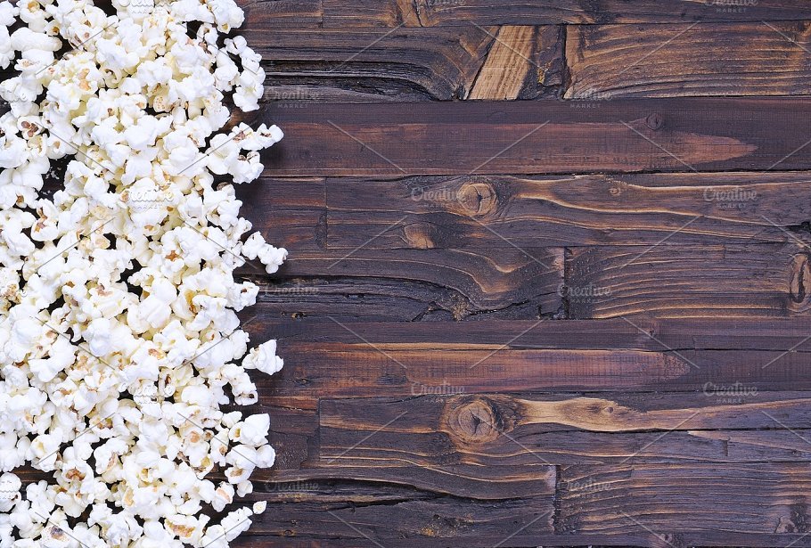 Popcorn on a wooden Background Mockup