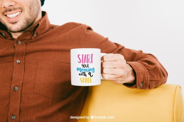 Relaxing man holding a cup of coffee PSD Design Mockup