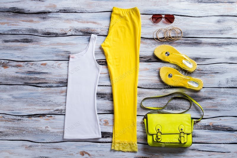 White Tank Top and Yellow Pant On Wooden Surface Mockup